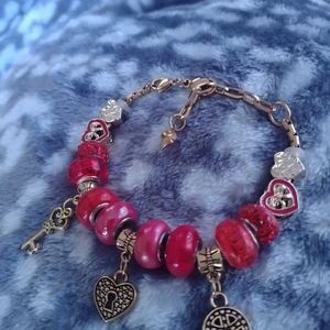 Red and gold snake chain charm bracelet